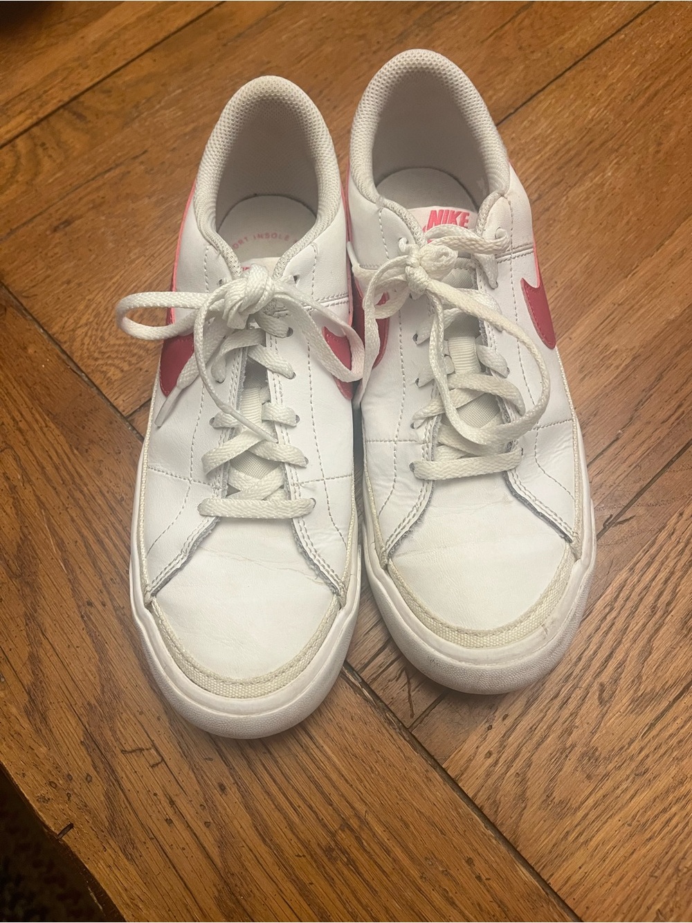Nike White Low-Top Sneakers with Pink Swoosh